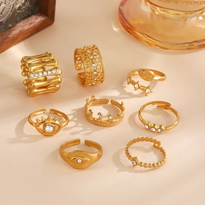 Eight-piece gold fashion ring set featuring devil's eye and crown with zircon inlay