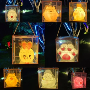 Portable glowing night light in a transparent gift box with a gold handle for kids