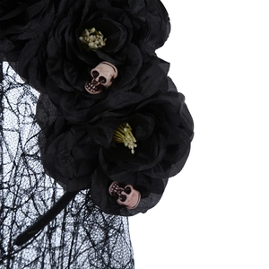 Detail of Gothic Halloween headband with black roses, skull accents and lace veil