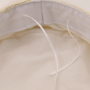 Inside view of women's navy cap with adjustable drawstring and sweatband details