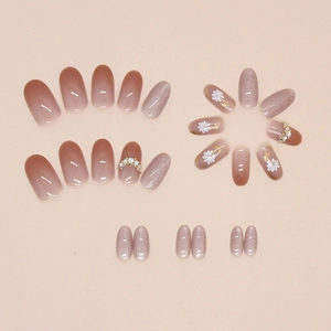Daisy cat-eye gemstone press-on nails with pink gradient and diamond accents