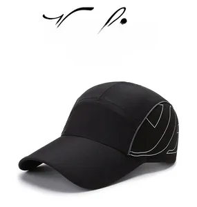 Detail of black quick-dry baseball cap featuring side white geometric curve patterns