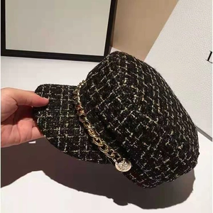 Elegant black tweed newsboy cap for women with gold chain detail and relief buttons