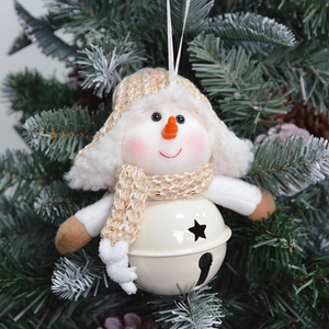 Plush snowman Christmas tree ornament with white metal bell on a festive pine branch
