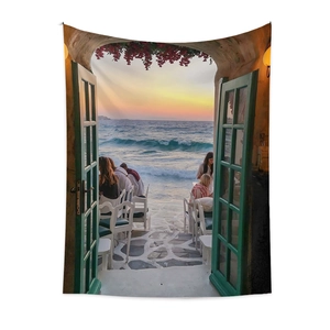 Detailed fabric texture of Bohemian wall tapestry with sunset coastal restaurant print