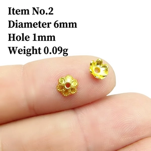 Detail view of 6mm hollow flower petal bead caps in gold finish for jewelry making