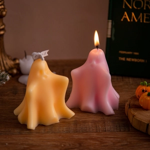 Ghost candles for Halloween decor featuring pink burning flame and yellow ghost design