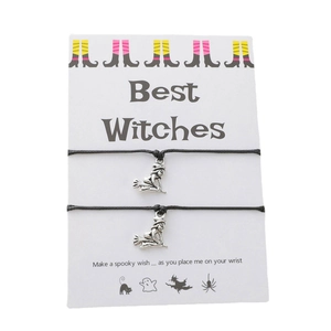 Detail of Best Witches charm bracelets with silver witch pendants on display card