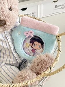 Detail of plush badge holder with transparent window and pink decorative bow