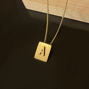 Minimalist 18K gold stainless steel necklace featuring a square letter A pendant