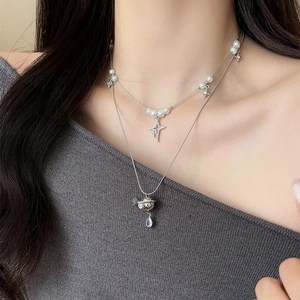 Double-layered silver necklace with pearl beads and sparkling Saturn planet pendant