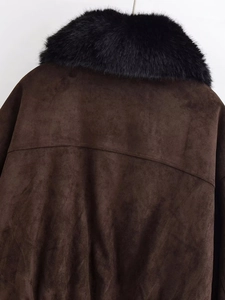 Detailed view of dark brown faux suede jacket featuring a thick black faux fur collar