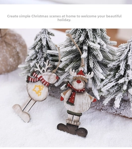 Detail of wooden reindeer ornaments with festive hand-painted scarves and rustic jute twine