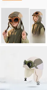 Detail of kids winter aviator hat with goggles and thick fleece lining in olive green