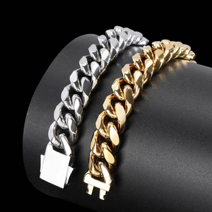 Polished silver and 18k gold stainless steel Cuban link bracelets with spring clasp