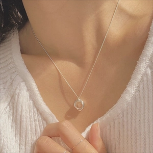 Detailed close-up of a 925 sterling silver triple interlocking circle pendant necklace