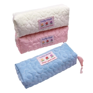 Quilted floral pencil cases in white pink and blue colors with Lucky Flower label