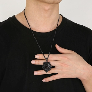 Men's hip hop rock style stainless steel wolf head pendant necklace worn by a male model