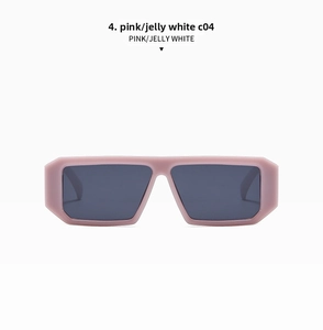 Detailed close-up of retro rectangular pink jelly frame sunglasses with dark grey lenses