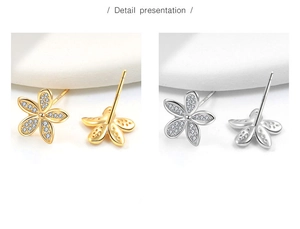 Detail view of S925 silver flower stud earrings with sparkling cubic zirconia inlay