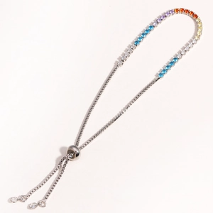 Detail view of silver bracelet with rainbow gradient crystals and adjustable slider clasp