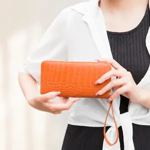 Chic orange crocodile embossed long zipper wallet for women with matching hand strap
