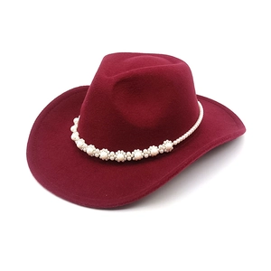 Detail of burgundy western wool hat featuring a white pearl flower headband ornament