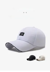 Detail of EEWK lettering on visor and square patch of a cotton canvas baseball cap