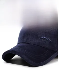 Detail of navy blue corduroy baseball cap showing sport embroidery and ribbed texture