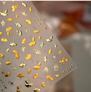 Detail of 3D gold gingko leaf nail stickers with metallic relief textures and M1247 design