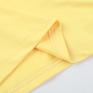 Close-up of high-quality double-stitch sewing on yellow knitted summer dress fabric