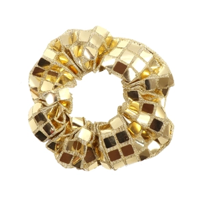 Detailed close-up of a shimmering gold sequin scrunchie with sparkling metallic accents