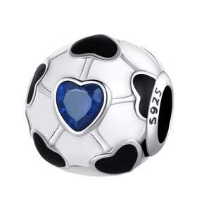 Macro shot of 925 silver soccer charm with blue gemstone heart and enamel detail