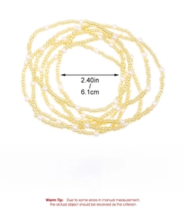 Detail of layered bohemian yellow seed bead chains with white pearls and sizing info