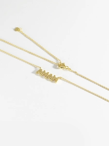Detail shot of golden MAMA pendant with S925 sterling silver stamp on the chain extension