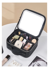 Detail view of large makeup case with LED mirror, adjustable dividers and vanity brushes