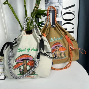 Fashionable mushroom embroidered nylon drawstring tote bag with woven rope handles