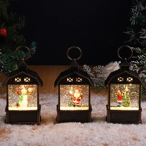 Close-up of three vintage bronze Christmas lanterns with snowmen and warm lighting