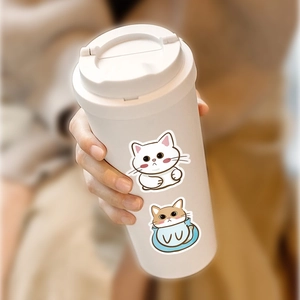 Sixty pieces of waterproof Japanese cartoon cat stickers on a white portable coffee mug
