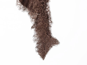 Close-up of dark brown intricate floral lace fabric texture for asymmetric skirts