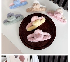 Detailed view of plush color-block shark hair claws in assorted pastel colors