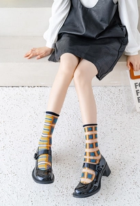 Detail of retro geometric pattern crew socks with colorful stripes and check designs