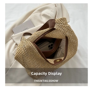 Top view of woven straw beach bag showing spacious interior with dark lining and magnetic clasp