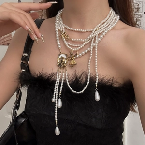 Vintage layered pearl necklace with gold angel pendant and tassel fringe for women