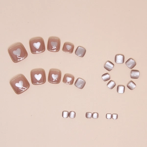 Pink cat eye press-on toenails with white heart patterns and glitter for summer