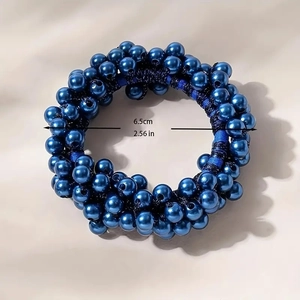 Detailed macro view of woven elastic hair tie with shiny metallic blue beads and 6.5cm size