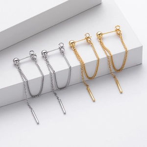 Detail of S925 silver chain drop earrings with cubic zirconia in gold and silver finish
