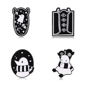 Set of four minimalist black and white Punpun metal enamel pins for bags and clothes