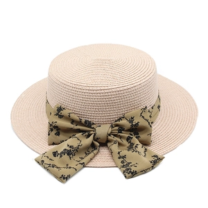 Flat top straw sun hat with olive green floral ribbon bow for summer beach vacation