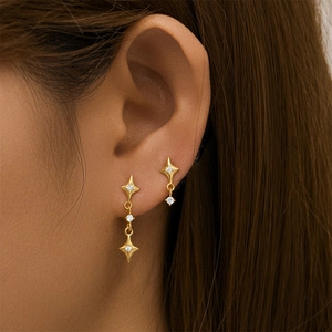 Detail of S925 sterling silver star earrings with long tassels and zircon stones